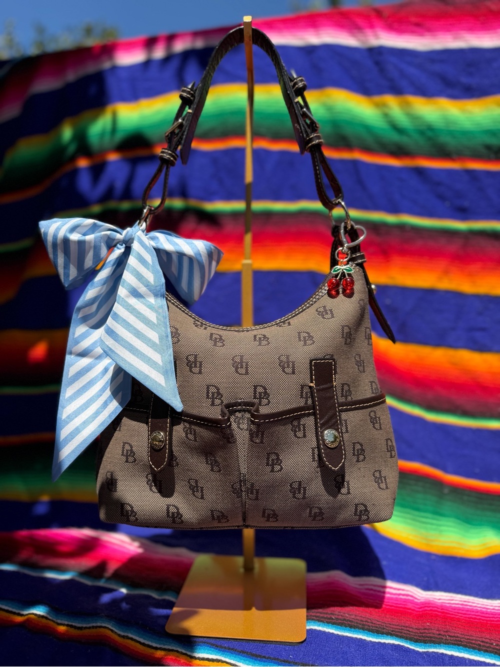 Dooney & Bourke Brown Monogram Shoulder Bag with Blue Bow
